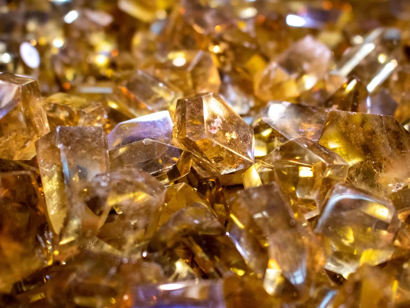 A close-up of warm golden gemstones