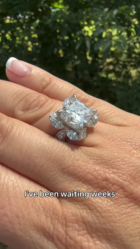 A 7.4 carat princess cut center stone