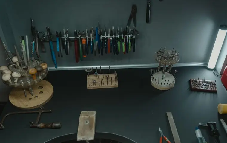 Setting tools and gravers arranged above a jeweler bench