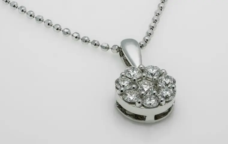A cluster of brilliant cut diamonds set in white metal