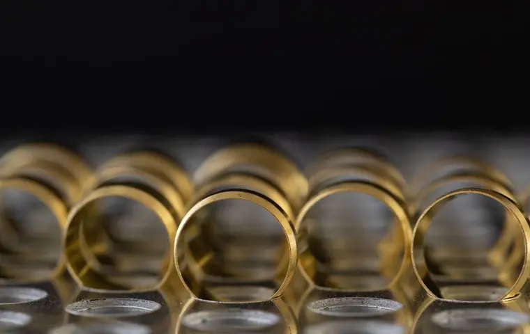 Yellow gold bands stacked and reflecting warm light