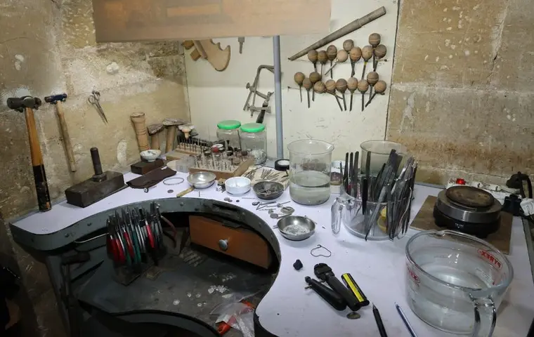 A jeweler workbench laid out with hand tools