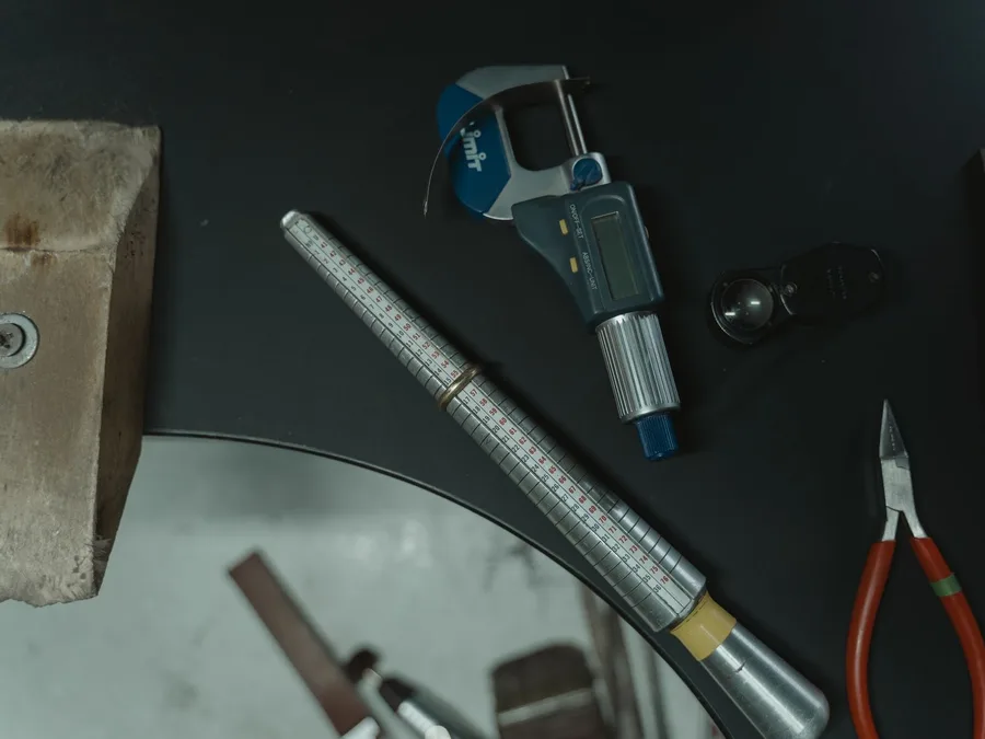 A jeweler's caliper and loupe used to measure a ring