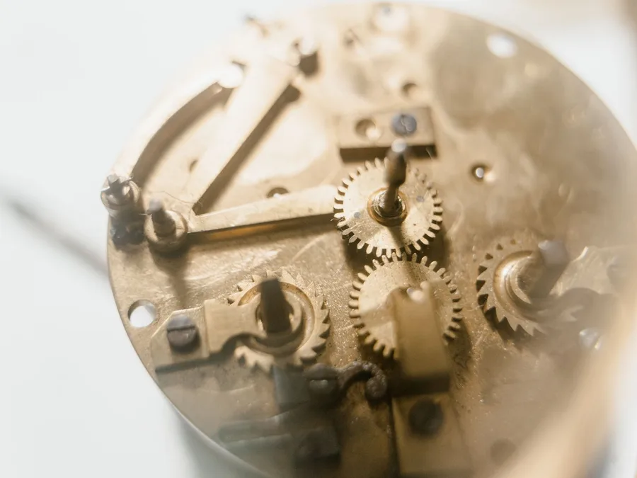 Brass gears inside an open watch mechanism